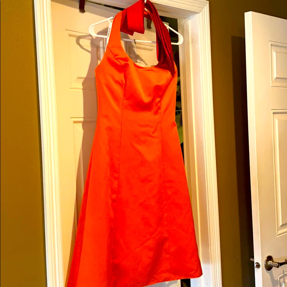 Orange and magenta halter dress.